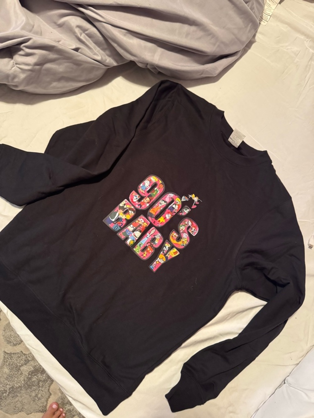 Black Crewneck Sweater with Colorful '90s Baby' Graphic